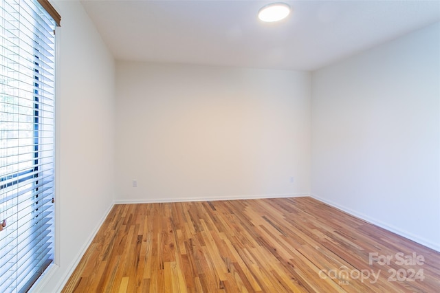 empty room with light hardwood / wood-style floors