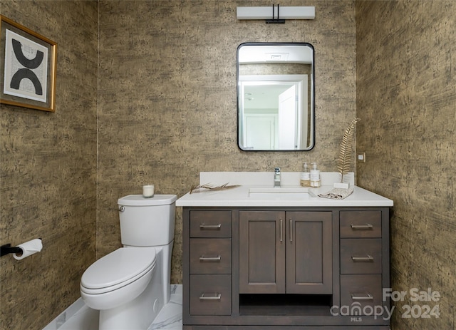 bathroom with vanity and toilet