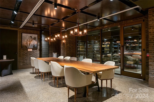 wine room with brick wall and bar area