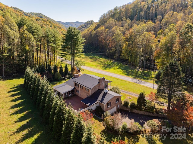 birds eye view of property with a mountain view