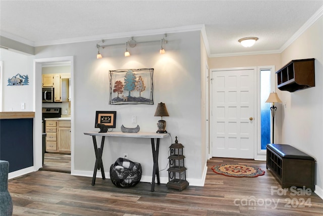 entryway with a textured ceiling, crown molding, and dark wood-type flooring