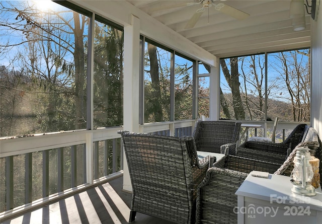 sunroom featuring ceiling fan