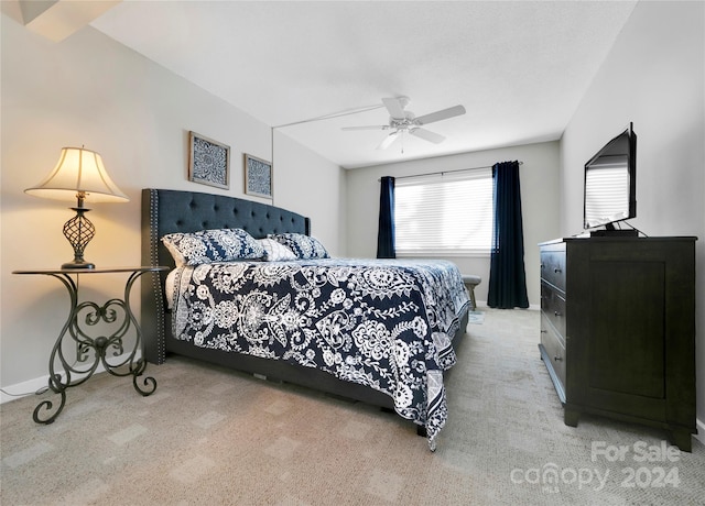 bedroom featuring ceiling fan and light carpet