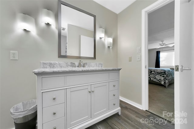 bathroom with vanity, hardwood / wood-style flooring, and ceiling fan