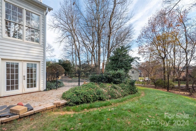 view of yard with french doors