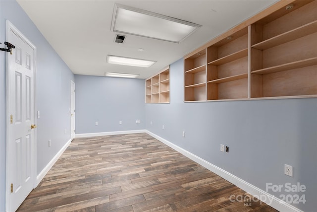 empty room featuring wood-type flooring