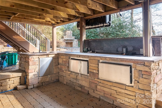 view of patio / terrace with an outdoor stone fireplace