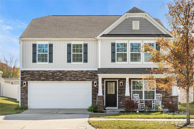 craftsman house featuring a porch and a garage