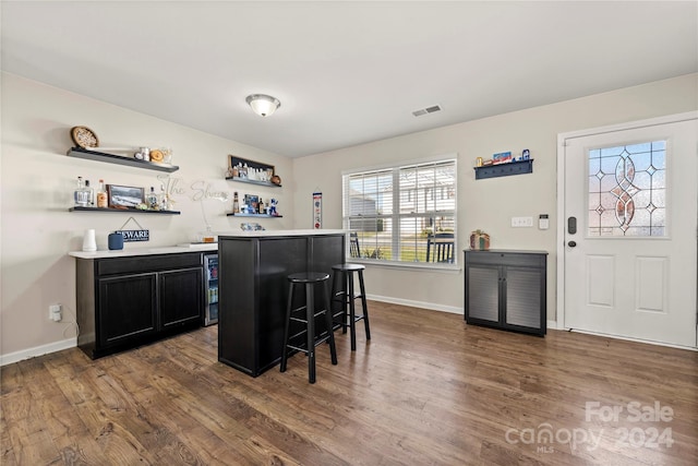 bar featuring dark wood-type flooring