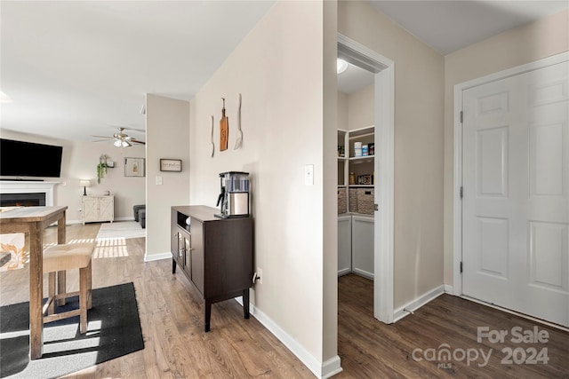 interior space with hardwood / wood-style floors and ceiling fan