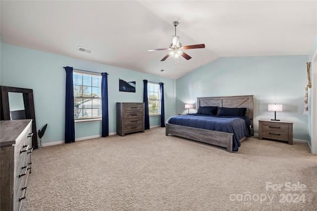 bedroom featuring ceiling fan, light colored carpet, and lofted ceiling