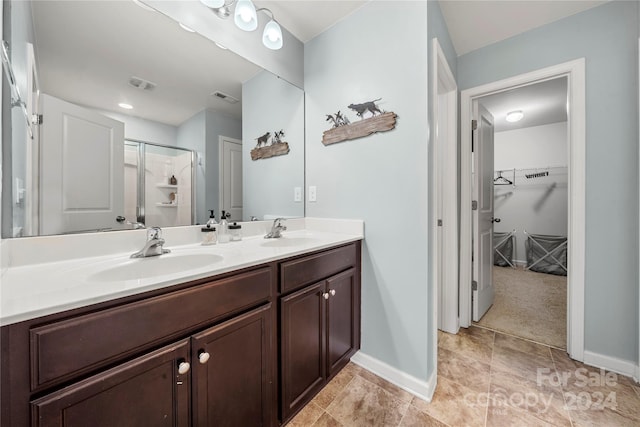 bathroom with vanity and an enclosed shower