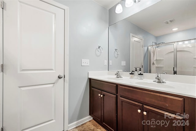 bathroom featuring vanity and walk in shower