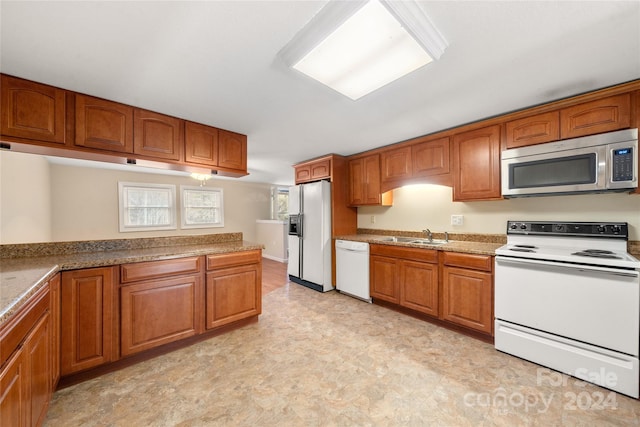 kitchen with sink and white appliances