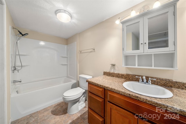 full bathroom with shower / bathing tub combination, vanity, a textured ceiling, and toilet