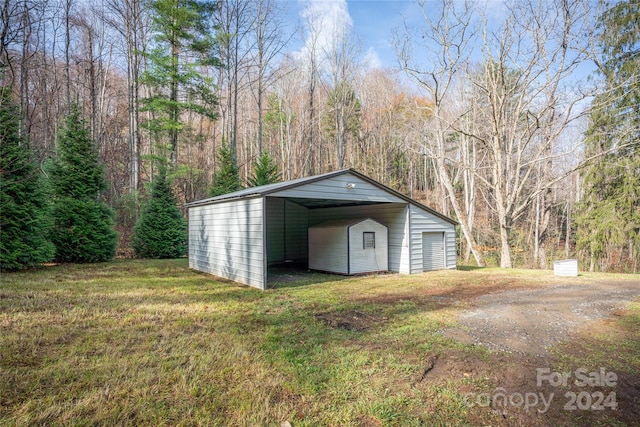 view of outbuilding featuring a yard and a carport