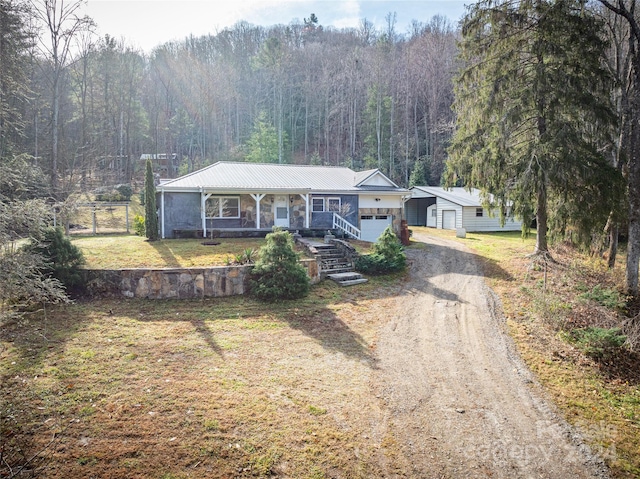 ranch-style house with a front yard and a porch