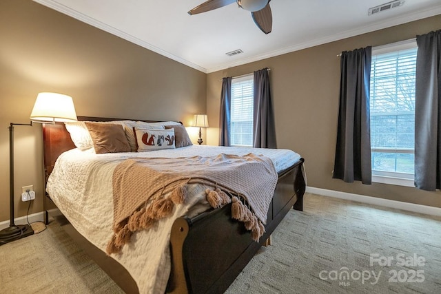 bedroom featuring multiple windows, visible vents, and ornamental molding