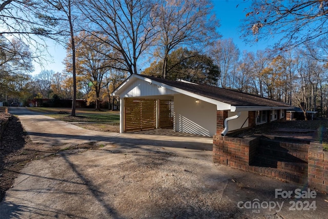 view of home's exterior with a carport