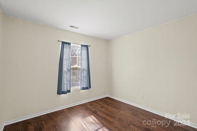 empty room with wood-type flooring