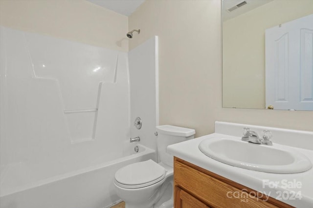 full bathroom featuring shower / bathing tub combination, vanity, and toilet