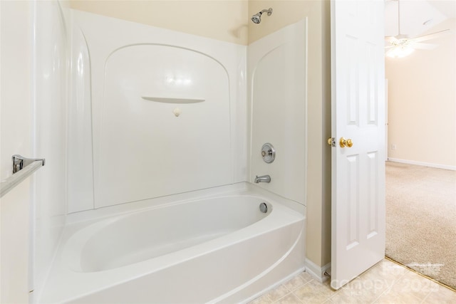 full bathroom with tile patterned flooring, shower / bath combination, and baseboards