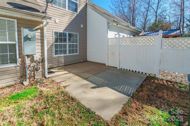 view of patio / terrace featuring fence