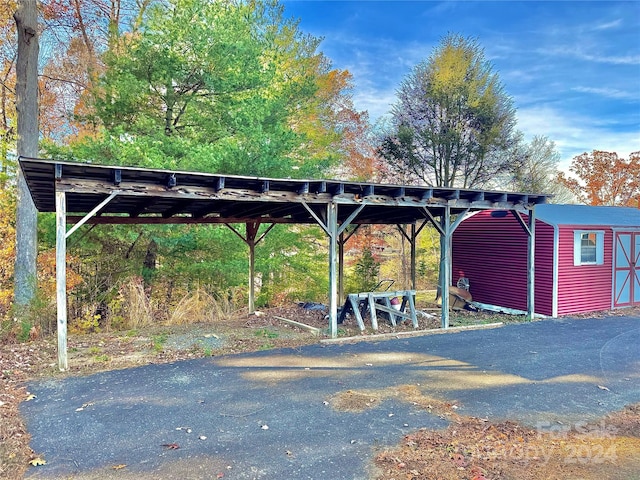 view of parking / parking lot with a carport