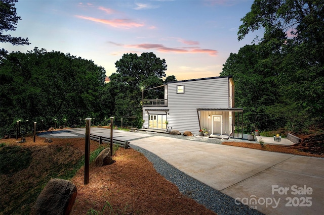 6534 Providence Rd, Charlotte, NC 28226 - view of front of house with driveway and a balcony