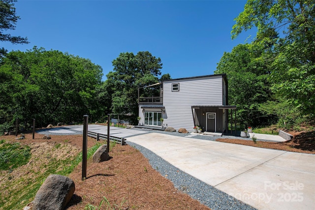 6534 Providence Rd, Charlotte, NC 28226 - rear view of property featuring a patio and a balcony