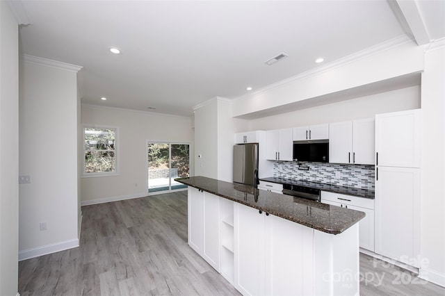 6534 Providence Rd, Charlotte, NC 28226 - kitchen featuring freestanding refrigerator, oven, open shelves, visible vents, and decorative backsplash