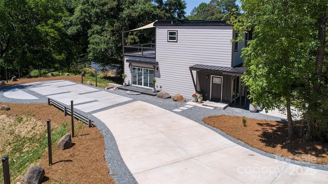 6534 Providence Rd, Charlotte, NC 28226 - modern home featuring driveway and a balcony