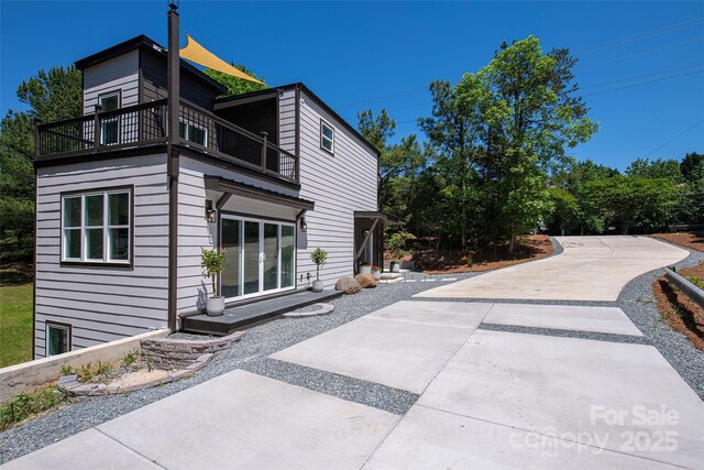 6534 Providence Rd, Charlotte, NC 28226 - view of side of home with a patio area and a balcony