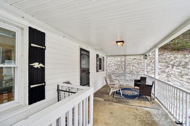 view of patio featuring a porch