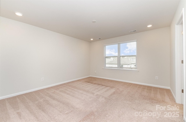 empty room featuring carpet floors