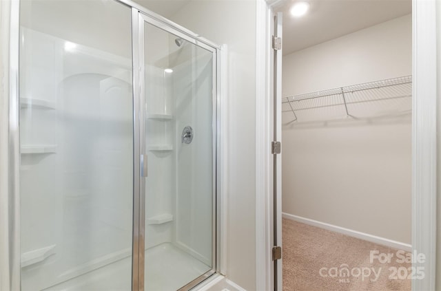 bathroom featuring an enclosed shower