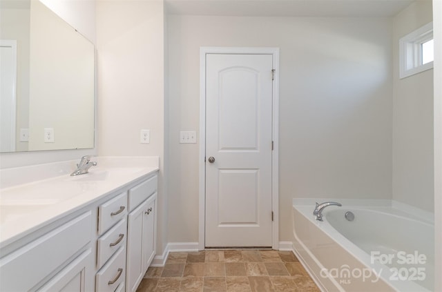 bathroom with vanity and a bathing tub