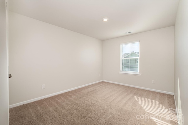 unfurnished room with carpet flooring