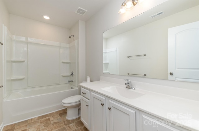 full bathroom with vanity, shower / bathtub combination, and toilet