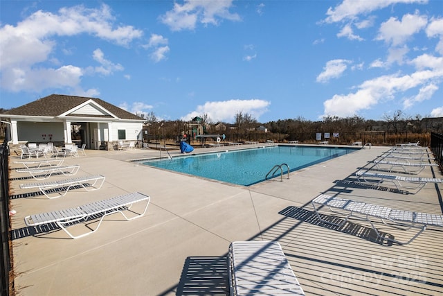 view of swimming pool with a patio