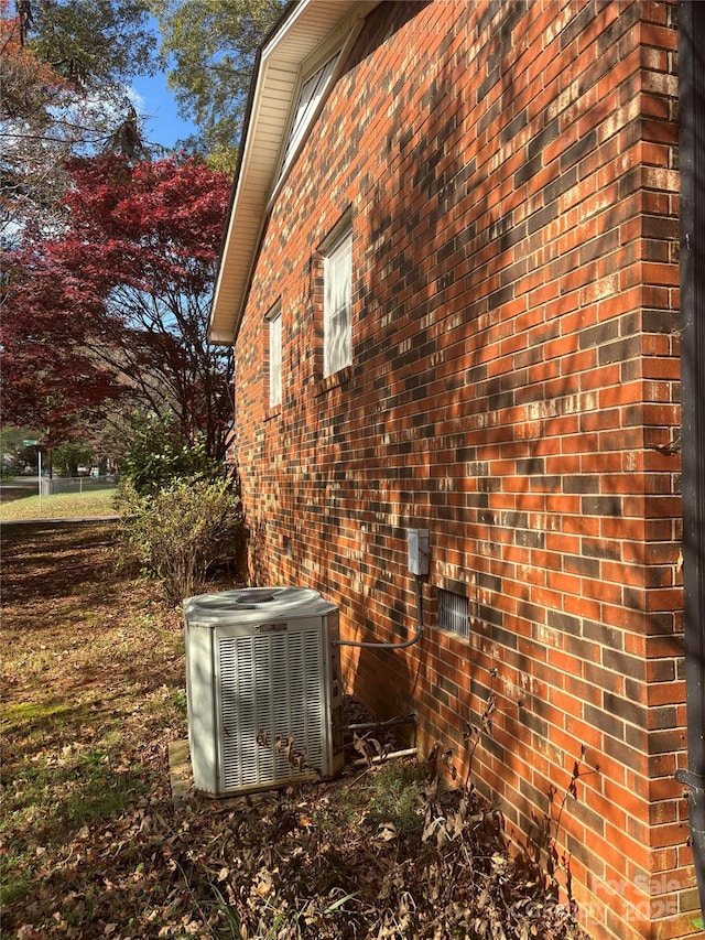 view of property exterior with central AC unit