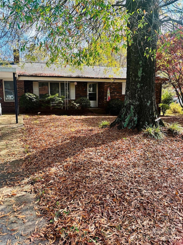 ranch-style house with brick siding