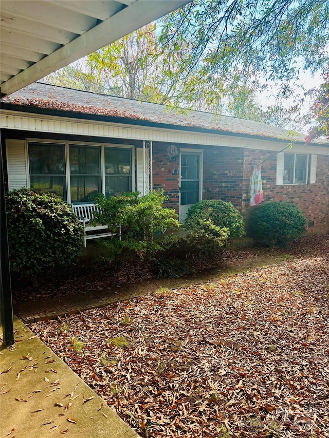 view of front of home featuring brick siding
