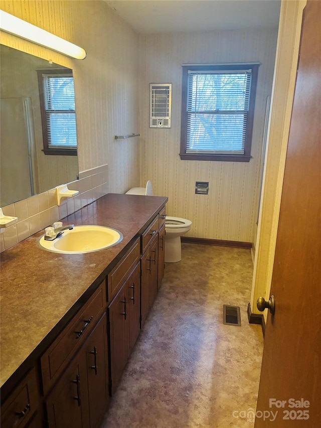 full bathroom featuring toilet and vanity