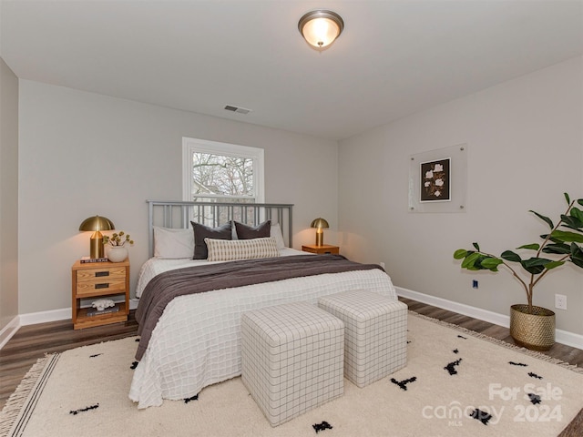 bedroom featuring dark wood-type flooring