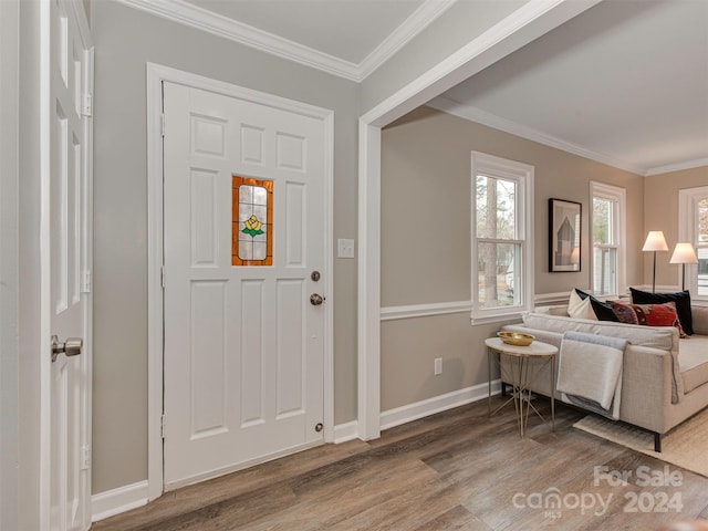 entryway featuring hardwood / wood-style floors and crown molding