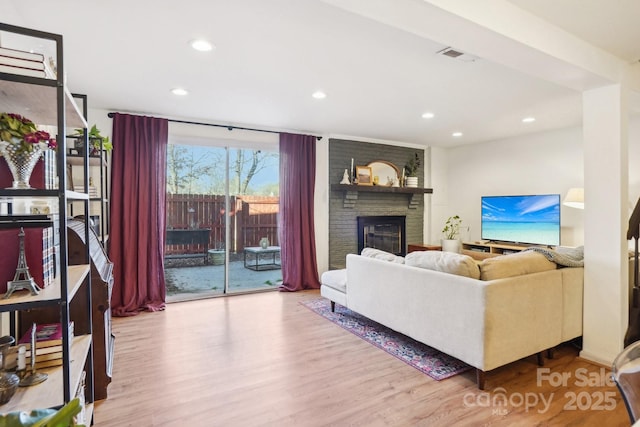 5300 Fair Wind Ln, Charlotte, NC 28212 - living area featuring recessed lighting, visible vents, a fireplace, and wood finished floors