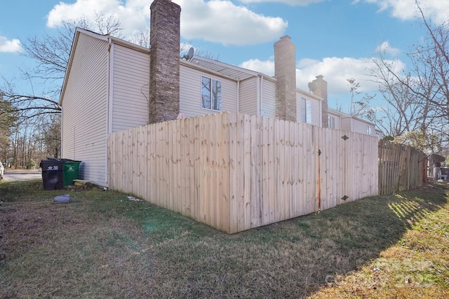 5300 Fair Wind Ln, Charlotte, NC 28212 - view of home's exterior with a chimney, fence, and a lawn