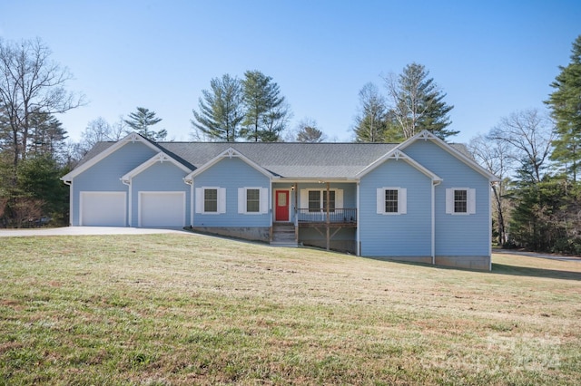 single story home with a porch, a garage, and a front yard