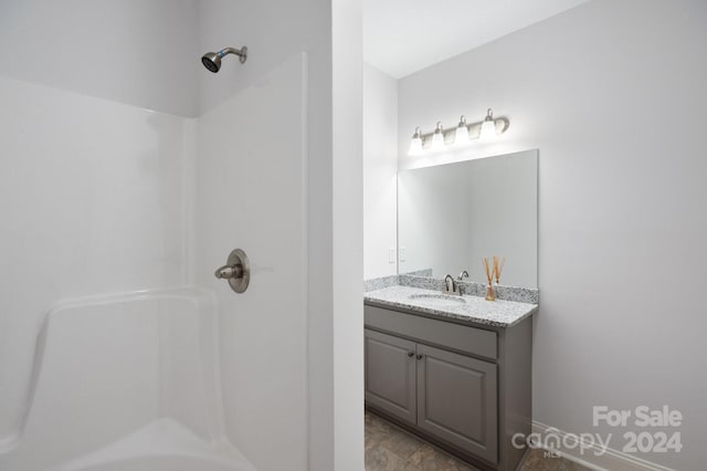 bathroom featuring vanity and tub / shower combination